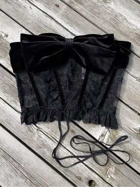 Urban Outfitters black lace corset with velvet bow